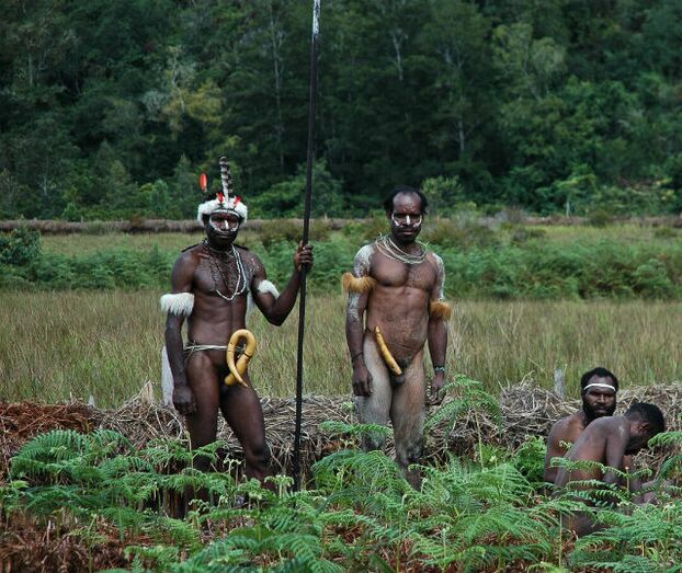 aborigines with extended limbs