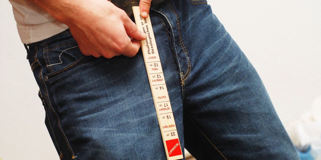 A man measures the duration of his member
